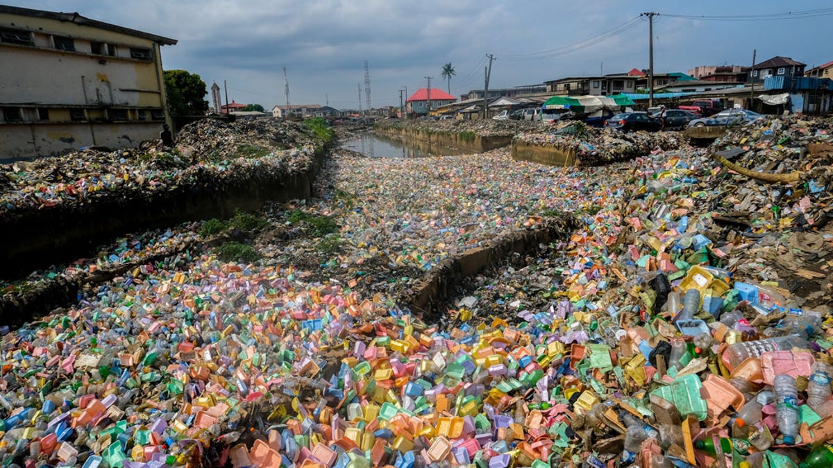 Uncollected waste on a busy city street